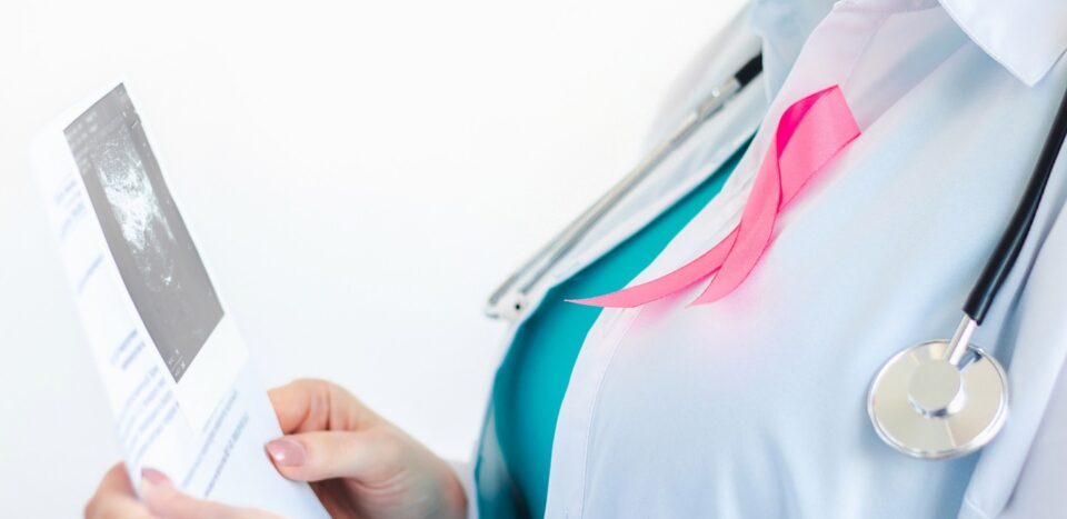 Woman doctor examining scan with pink ribbon 2026 09 24 07 24 37 utc 1